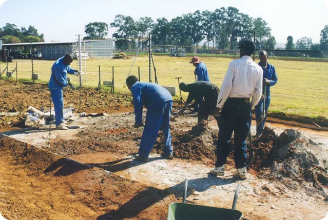 Mixing sand and cement for the floor